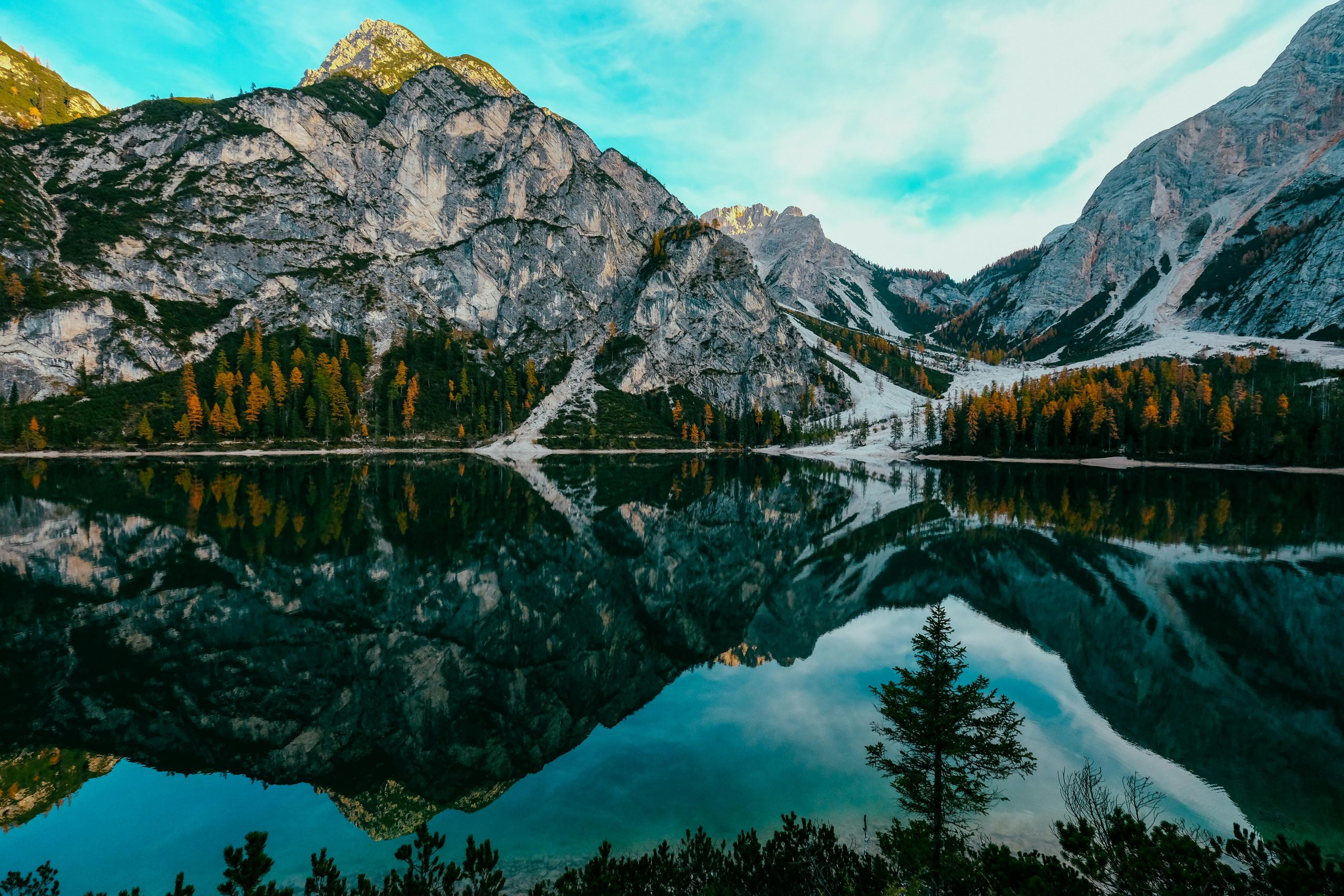 a mountain lake surrounded by trees and mountains at The Stinger