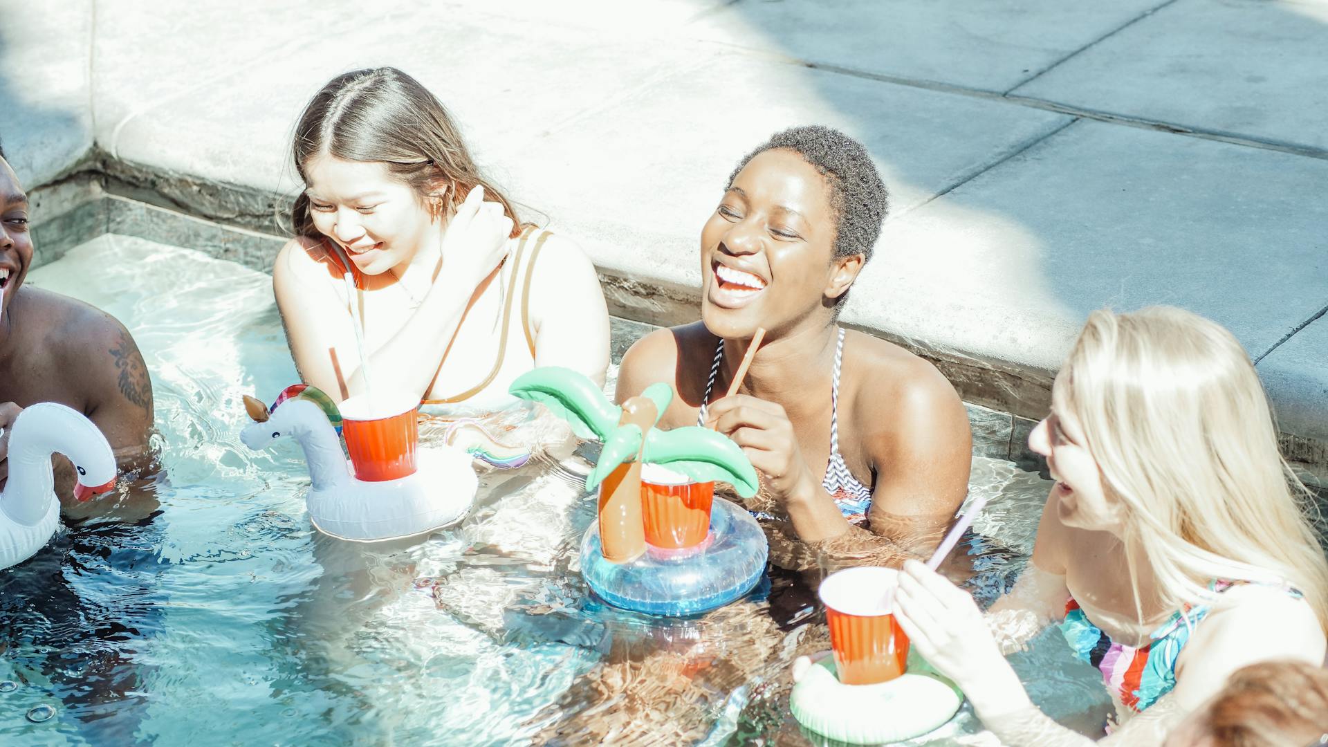 Friends celebrating Fourth of July at the pool
